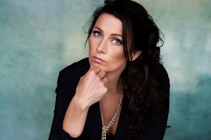 Dynamic stage performance of a guitarist during a live rock concert.