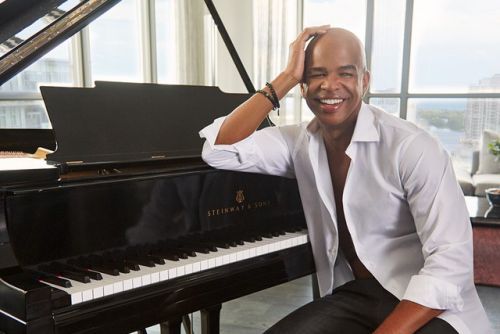 Dynamic stage performance of a guitarist during a live rock concert.