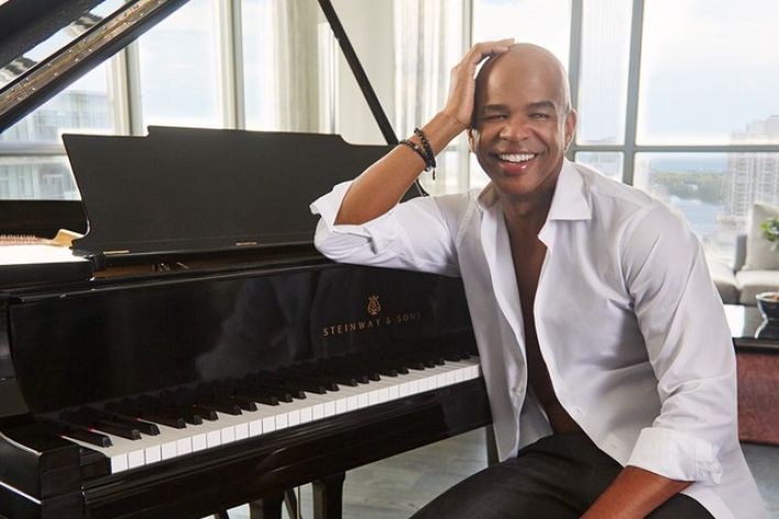 Dynamic stage performance of a guitarist during a live rock concert.