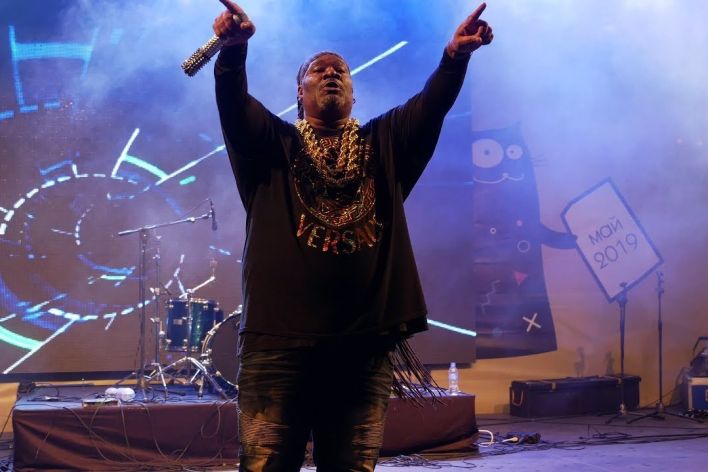 Dynamic stage performance of a guitarist during a live rock concert.